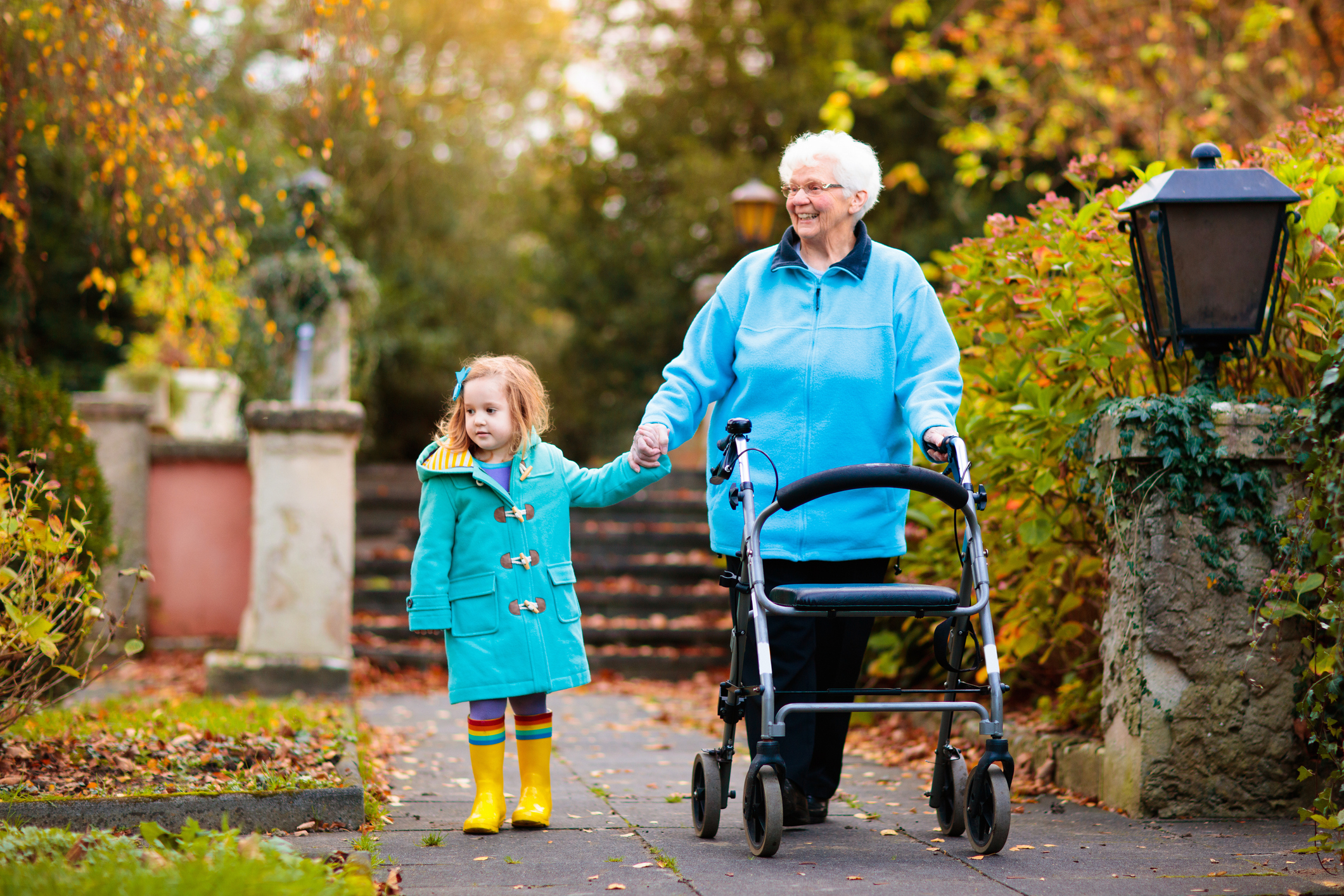 Grandmother holding granddaughter's hand