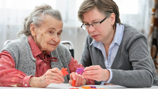 Senior Woman With Her Care Nurse